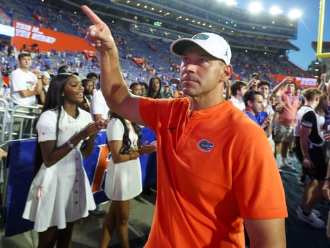 Florida head coach Jon Sumrall reacts to fans after Florida beat Ole Miss 52-28 after the second half an NCAA football game