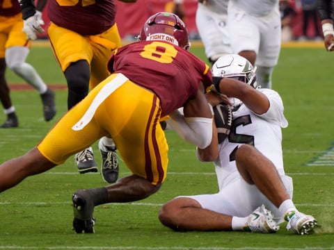 2026-09-27T004052Z_907802717_MT1USATODAY29926721_RTRMADP_3_OREGON-QUARTERBACK-DANTE-MOORE-IS-HIT-AFTER-SLIDING-BY-USC