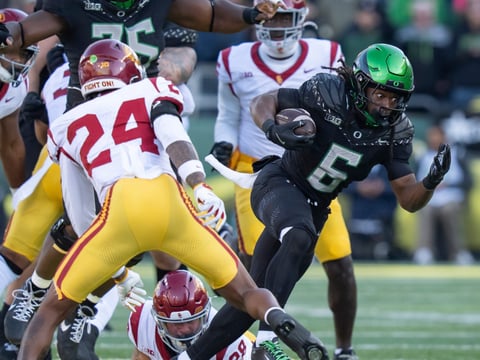 Oregon running back Noah Whittington carries the ball as the Oregon Ducks host the USC Trojans on Nov. 22, 2025, at Autzen Stadium in Eugene, Oregon