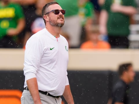 Oregon head coach Dan Lanning takes in the rain as the Oregon Ducks face the Oklahoma State Cowboys on Sept. 12, 2026, at Boone