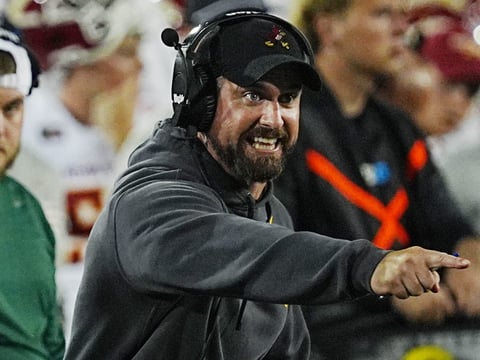 Iowa State football coach Jimmy Rogers reacts to an official's call during the third quarter of the Cy-Hawk Series football game