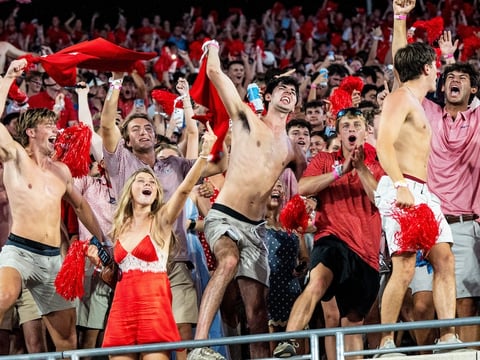 Ole Miss fans celebrate after Ole Miss defensive back Jaylon Braxton (2) caught a game winning interception during a college