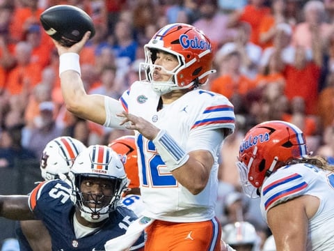 Florida Gators quarterback Aaron Philo (12) throws the ball as Auburn Tigers take on Florida Gators at Jordan-Hare Stadium in