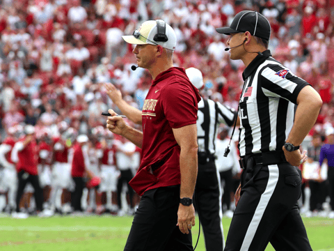 Sep 19, 2026; Tuscaloosa, Alabama, USA; Florida State Seminoles head coach Mike Norvell walks off with an official during the second quarter against the Alabama Crimson Tide at Saban Field at Bryant-Denny Stadium. Mandatory Credit: David Leong-Imagn Images