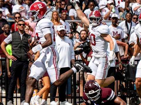 Alabama quarterback Keelon Russell (12) carries the ball for a touchdown during a college football game between Mississippi