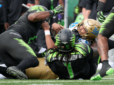 UCLA QB Nico Iamaleava tackled by Oregon DL Bear Alexander