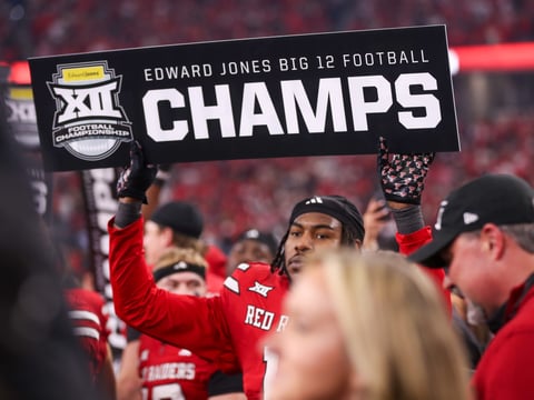 Texas Tech's Charles Esters III holds a sign after the Big 12 Conference championship football game, Saturday, Nov. 6, 2025, at