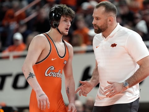 2026-02-23T015240Z_276146467_MT1USATODAY28317634_RTRMADP_3_OKLAHOMA-STATE-S-JAX-FORREST-TALKS-WITH-COACH-DAVID-TAYLOR (1)