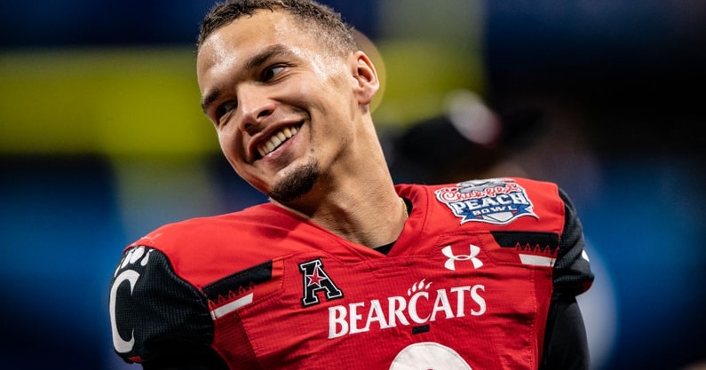 Desmond Ridder of the Cincinnati Bearcats looks to pass during the