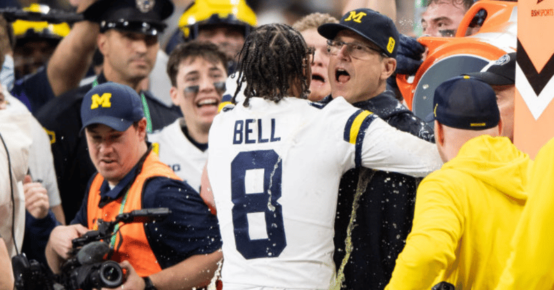 Michigan coach Jim Harbaugh and receiver Ronnie Bell