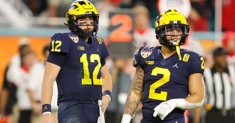 Michigan quarterback Cade McNamara and running back Blake Corum 