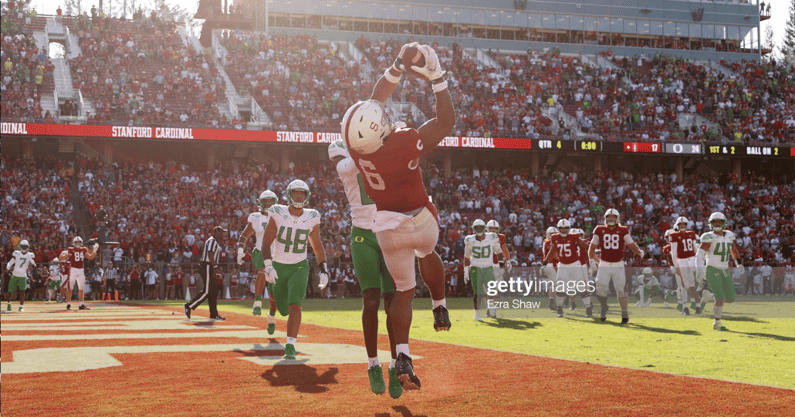 STANFORD, CALIFORNIA - OCTOBER 02: Elijah Higgins #6 of the Stanford Cardinal makes the tying touchdown catch at the end of the fourth quarter while covered by DJ James #0 of the Oregon Ducks at Stanford Stadium on October 02, 2021 in Stanford, California
