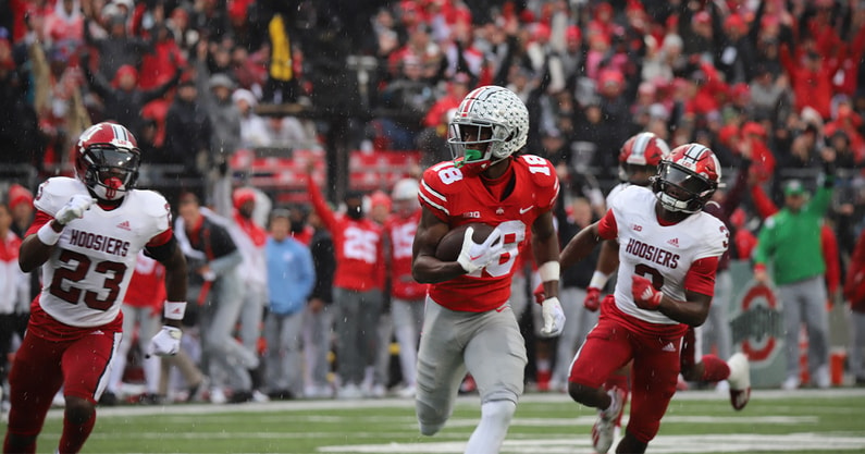 Ohio State wide receiver Marvin Harrison Jr., right, catches a touchdown  during the first half in the Rose Bowl NCAA college football game against  Utah Saturday, Jan. 1, 2022, in Pasadena, Calif. (