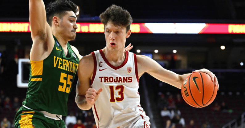 Drew Peterson #13 of the USC Trojans is defended by Robin Duncan #55 of the Vermont Catamounts as he drives to the basket in the first half at Galen Center on November 15, 2022 in Los Angeles, California. (Photo by Jayne Kamin-Oncea/Getty Images)
