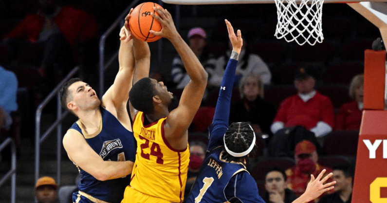 Frantisek Barton #24 and Dakota Leffew #1 of the Mount St. Mary's Mountaineers defend Joshua Morgan #24 of the USC Trojans as he goes up for a basket in the second half at Galen Center on November 18, 2022 in Los Angeles, California. (Photo by Jayne Kamin