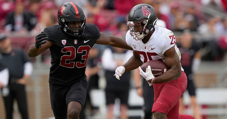 STANFORD, CALIFORNIA - NOVEMBER 05: Nakia Watson #25 of the Washington State Cougars runs with the ball pursued by David Bailey #23 of the Stanford Cardinal during the second quarter of an NCAA football game at Stanford Stadium on November 05, 2022 in Sta