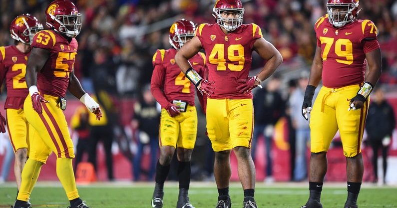 LOS ANGELES, CA - NOVEMBER 11: USC Trojans linebacker Shane Lee (53), USC Trojans defensive lineman Tuli Tuipulotu (49) and USC Trojans defensive lineman Dejon Benton (79) look on during a game between the Colorado Buffaloes and the USC Trojans on Novembe