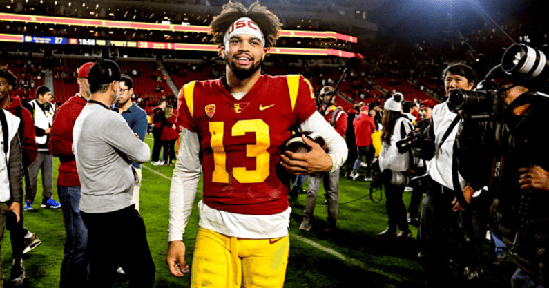 Quarterback Caleb Williams #13 of the USC Trojans celebrates USC Trojans defeated the Notre Dame Fighting Irish 38-27 during a NCAA football game at the Los Angeles Memorial Coliseum in Los Angeles on Saturday, November 26, 2022. (Photo by Keith Birmingha