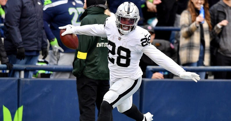 Raiders Josh Jacobs Jaguars Evan Engram join Ravens Lamar Jackson saquon barkley  in franchise tag holdout Tony Pollard Daron Payne