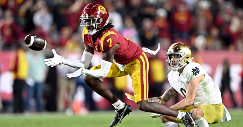 Defensive back Calen Bullock #7 of the USC Trojans intercepts a pass intended for wide receiver Braden Lenzy #0 of the Notre Dame Fighting Irish in the second half of a NCAA football game at the Los Angeles Memorial Coliseum in Los Angeles on Saturday, No