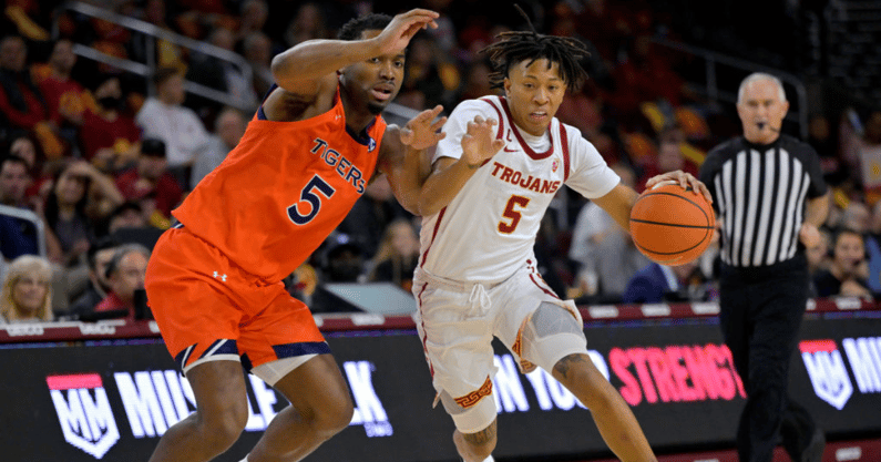 Boogie Ellis #5 of the USC Trojans drives past Chris Moore #5 of the Auburn Tigers in the first half at Galen Center on December 18, 2022 in Los Angeles, California. (Photo by Jayne Kamin-Oncea/Getty Images)