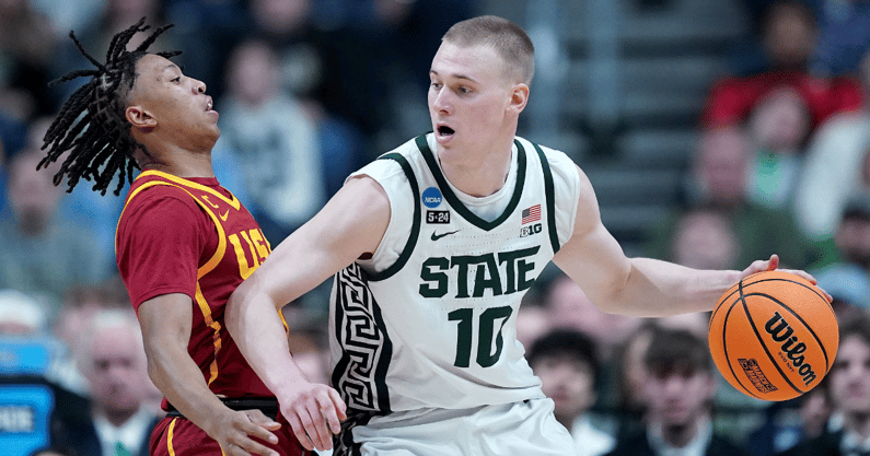 Joey Hauser dribbles in post vs. USC