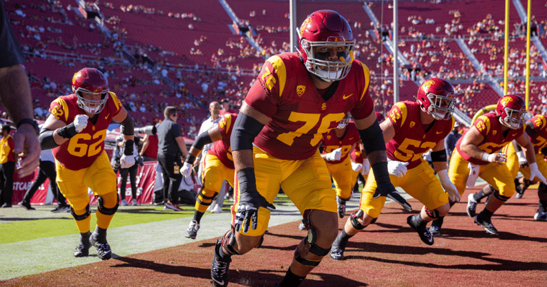 USC's Mason Murphy and the Trojans' offensive linemen warm up before a game against the San Jose State Spartans