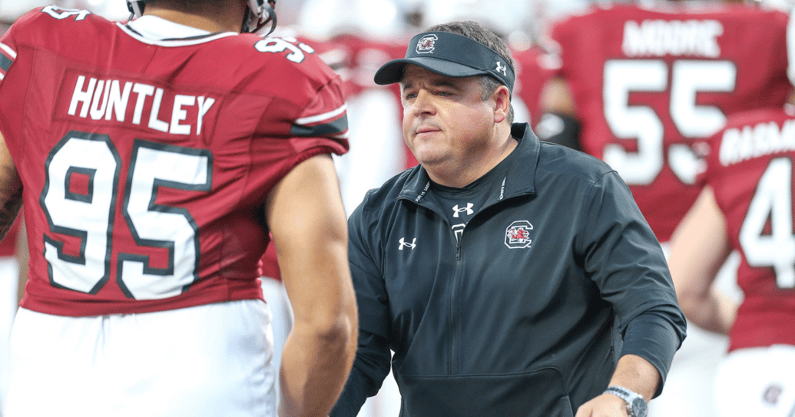 South Carolina offensive coordinator Dowell Loggains hi-fives players before the North Carolina game