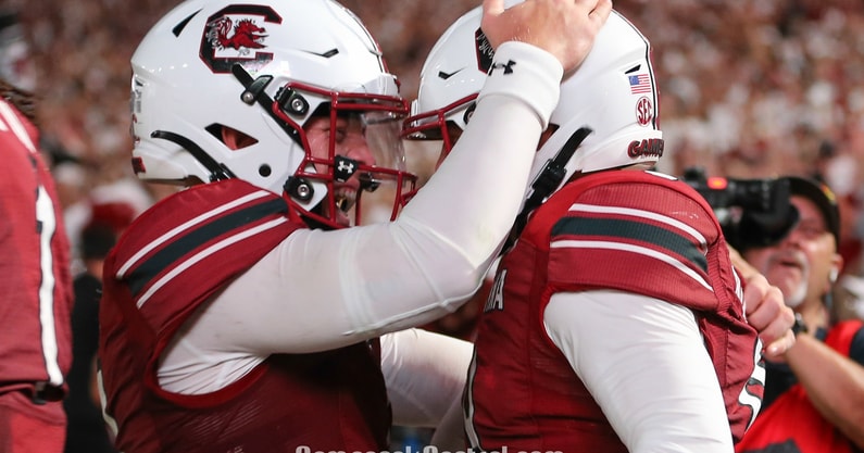 South Carolina quarterback Spencer Rattler celebrates a touchdown with Luke Doty
