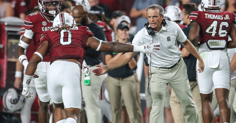South Carolina head coach hi-fives Debo Williams after a play against Furman