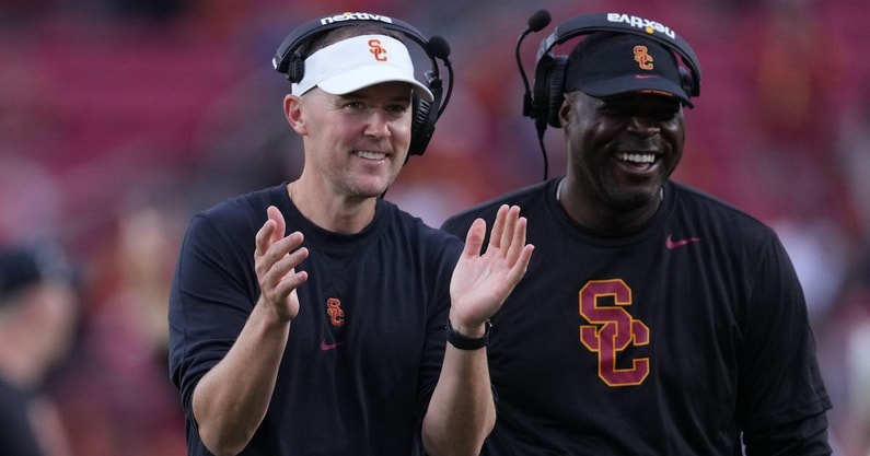 USC Trojans head coach Lincoln Riley and wide receivers coach Dennis Simmons
