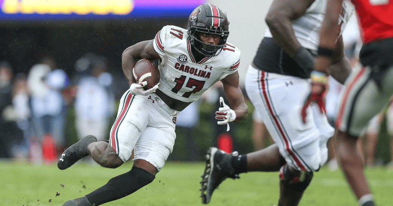 South Carolina receiver Xavier Legette catches a pass and runs with it against Georgia