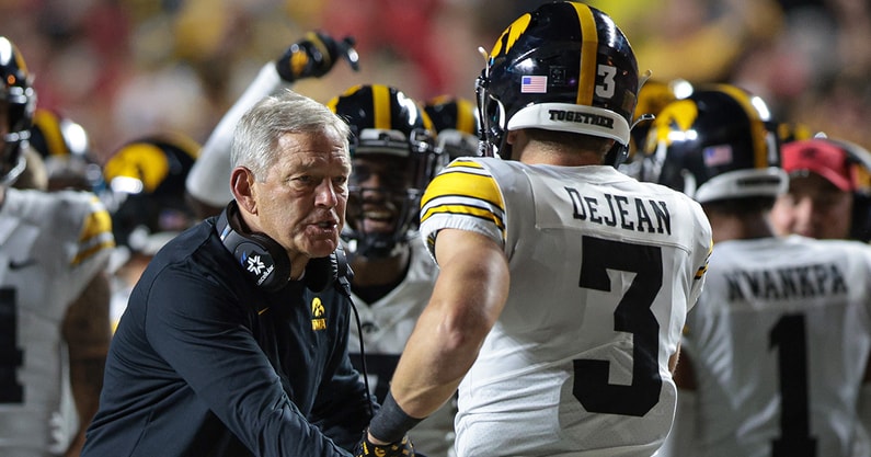 Iowa head coach Kirk Ferentz and DB Cooper DeJean