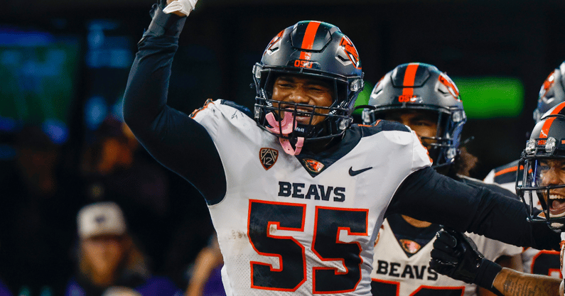 Oregon State Beavers linebacker Easton Mascarenas-Arnold (55) celebrates with defensive back Jaydon Grant (3) after returning an interception for a touchdown against the Washington Huskies during the second quarter at Alaska Airlines Field at Husky Stadium