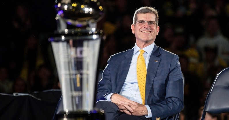 Jim Harbaugh looks on during Michigan's national championship celebration.