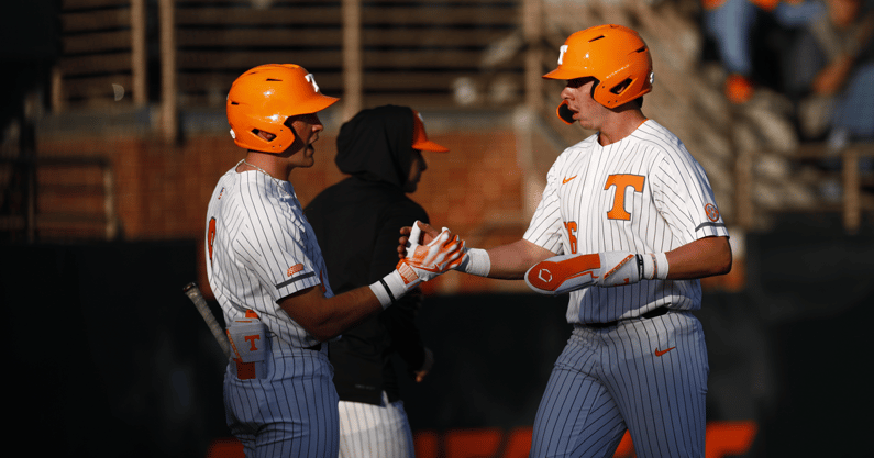 Tennessee baseball players celebrate after scoring a run. Credit: Tennessee Athletics