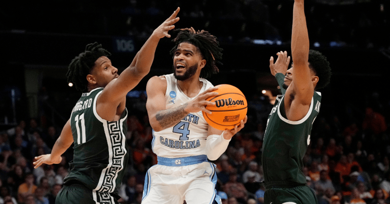 North Carolina Tar Heels guard RJ Davis (4) shoots against Michigan State Spartans guard A.J. Hoggard (11) in the second round of the 2024 NCAA Tournament at the Spectrum Center - Jim Dedmon, USA TODAY Sports