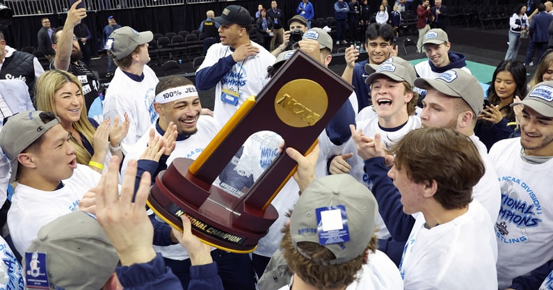 Penn State wrestling holds the 2024 NCAA Championship trophy. (Reese Strickland-USA TODAY Sports)