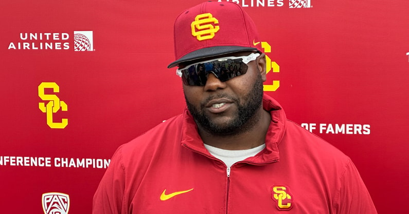 USC defensive line coach Eric Henderson speaks to the media following a spring ball practice with the Trojans