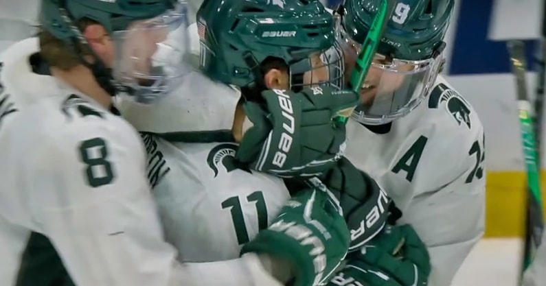 Michigan State senior Jeremy Davidson is swarmed by teammates Maxim Štrbàk and Nico Müller after Davidson’s game-winning goalie in the NCAA Tournament Regional Semifinal victory over Western Michigan, Friday at Centene Community Ice Center in Maryland Heights, MO.