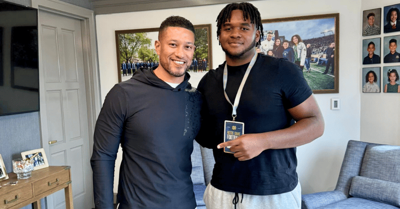 2026 OL Darius Gray (right) with Notre Dame coach Marcus Freeman (left) on a visit April 10, 2024 - Credit: @dariusgrayy_