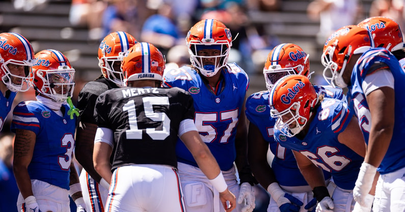 Florida Gators quarterback Graham Mertz (15) talks with his team in a huddle during the second half at the Orange and Blue spring football game at Steve Spurrier Field at Ben Hill Griffin Stadium in Gainesville, FL on Saturday, April 13, 2024. [Matt Pendleton/Gainesville Sun]
