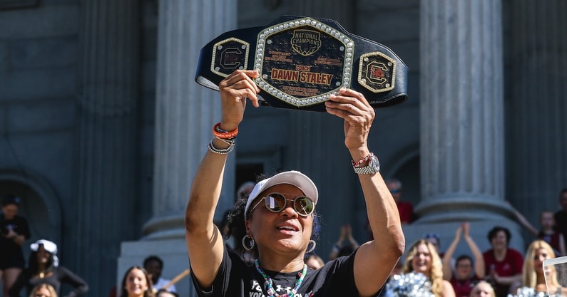 South Carolina basketball coach Dawn Staley holds up a championship belt during Sunday's national title parade (Photo: Katie Dugan | GamecockCentral.com)