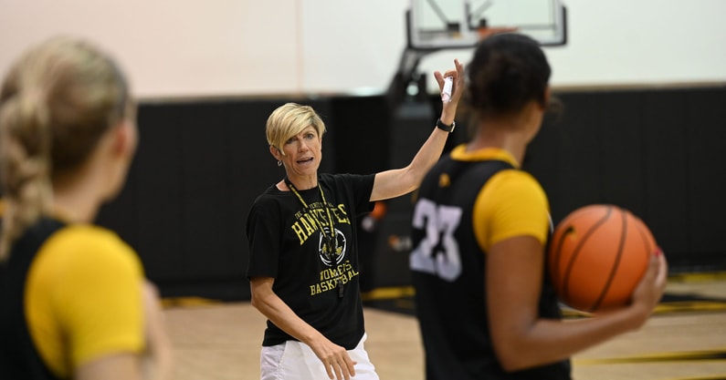 Iowa head coach Jan Jensen teaches during a practice. (Photo by Dennis Scheidt)