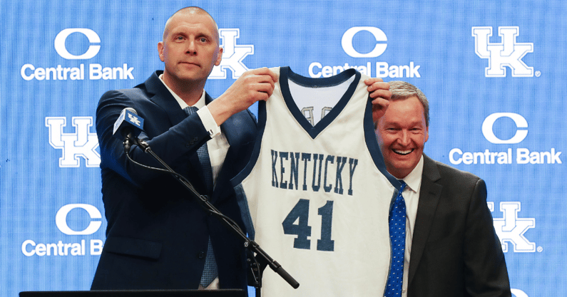 Former Kentucky player turned head coach Mark Pope holds up his game-worn No. 41 Kentucky jersey at his introductory press conference - © Sam Upshaw Jr./Courier Journal / USA TODAY NETWORK