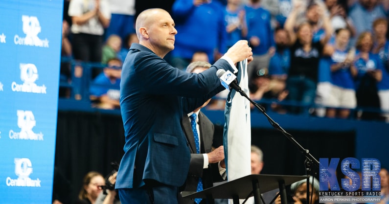 Mark Pope holds up his old jersey at his introductory press conference - Aaron Perkins, Kentucky Sports Radio