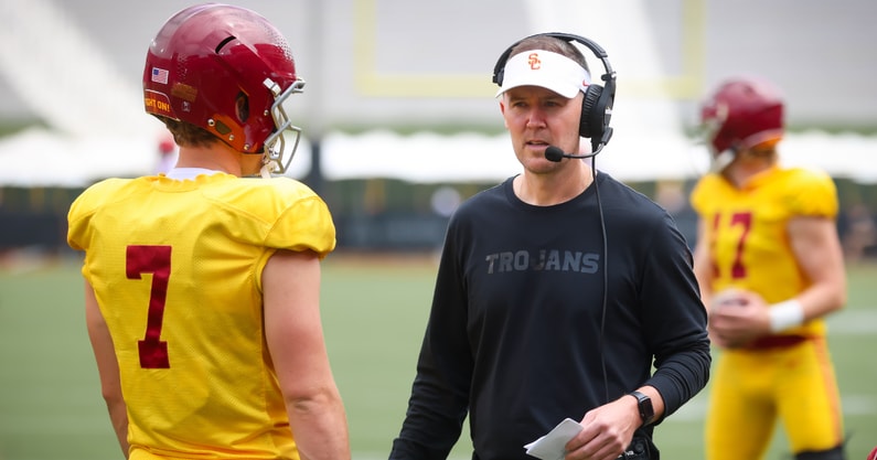 USC head coach Lincoln Riley speaks to quarterback Miller Moss during the Trojans' 2024 spring game