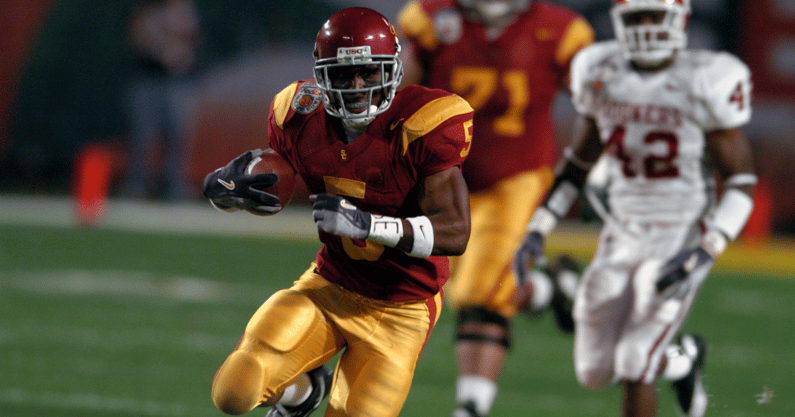 USC Trojans tailback Reggie Bush heads up field on the first play form scrimmage in a 55-19 victory over Oklahoma in the FedEx Orange Bowl during the BCS National Championship at Pro Player Stadium