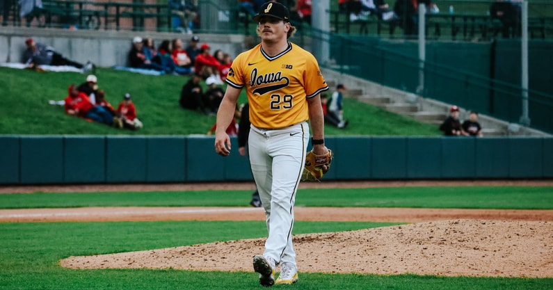 Jack Young walks off the mound after striking out a Nebraska batter. (Photo by Sam Basler/UI Athletics)