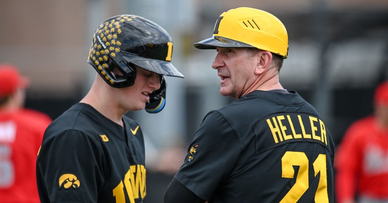 Rick Heller talks with Sam Petersen during a game against Ohio State. (Photo by Dennis Scheidt)